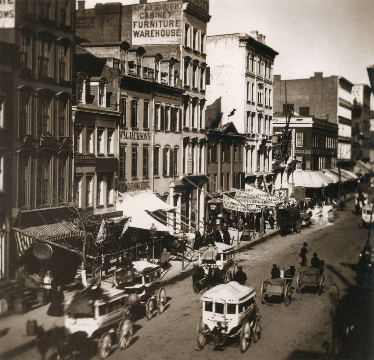 Horse-drawn carriage, shops, and people on Broadway, 1858 Horse-drawn carriage, shops, and people on Broadway, 1858
