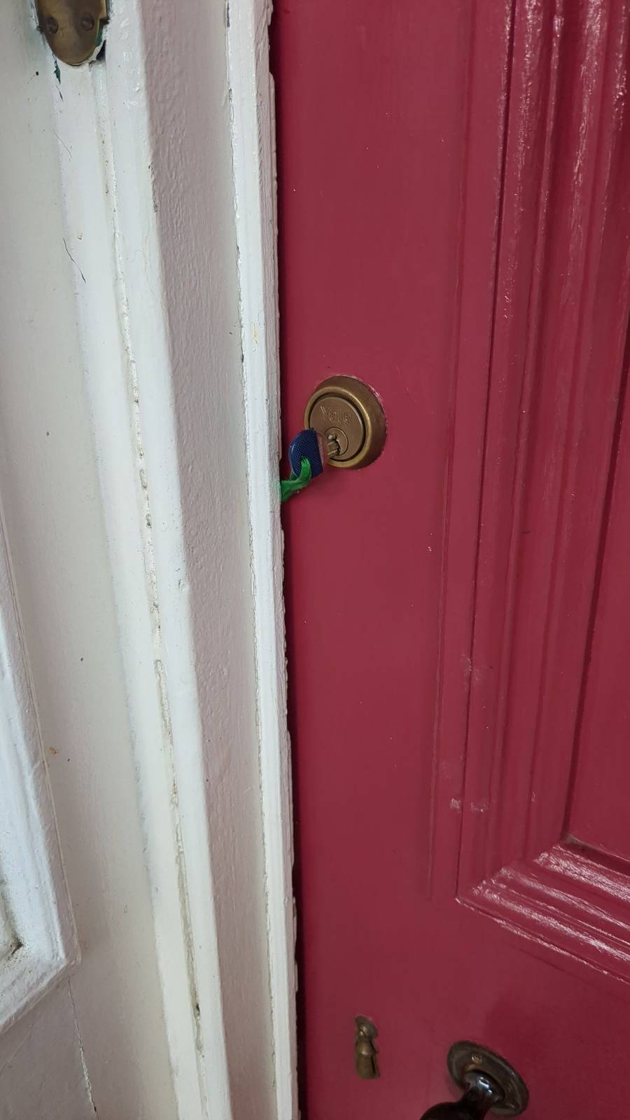 Key stuck in door by a ribbon